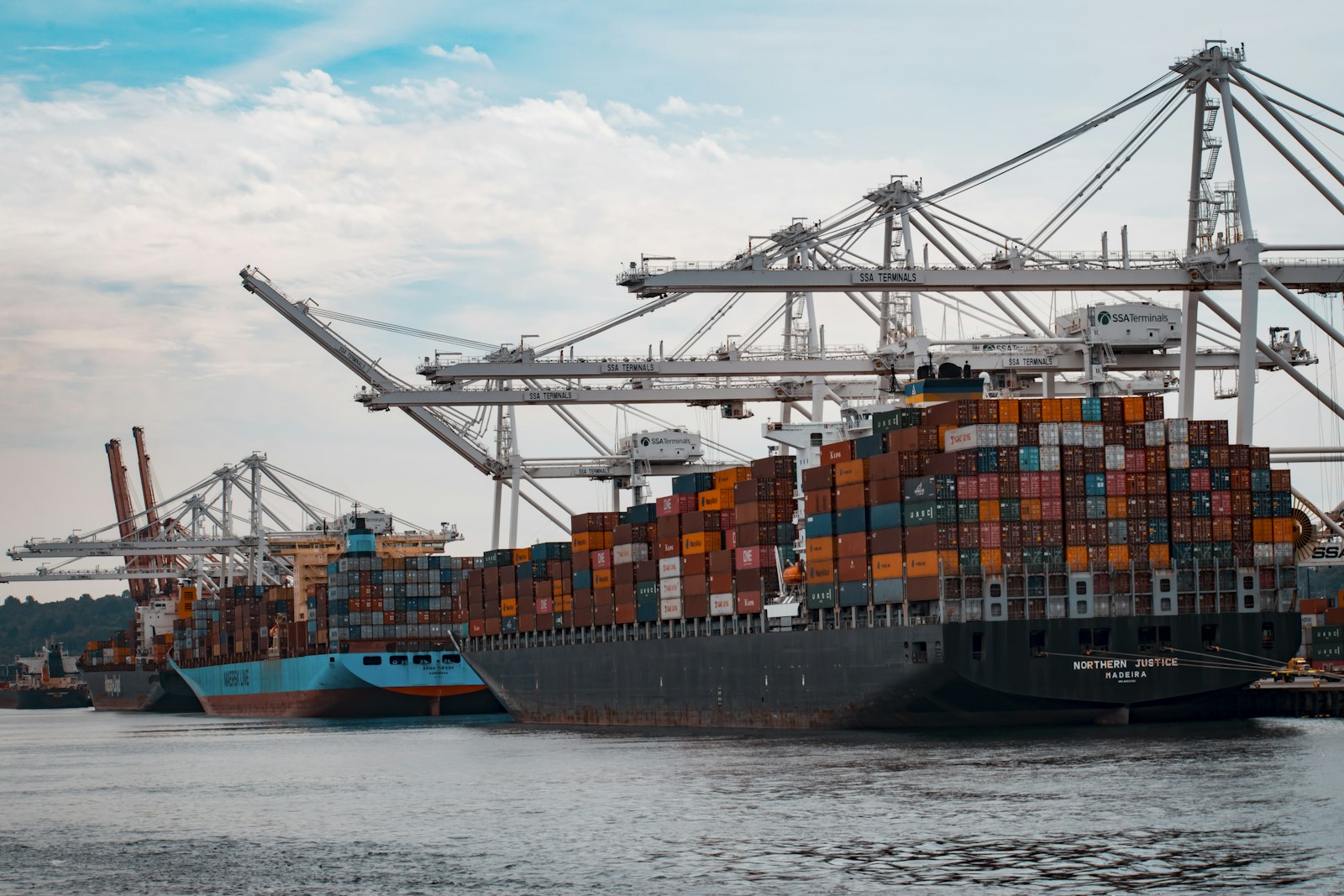 Cargo ship at a port at dusk handling international trade flows